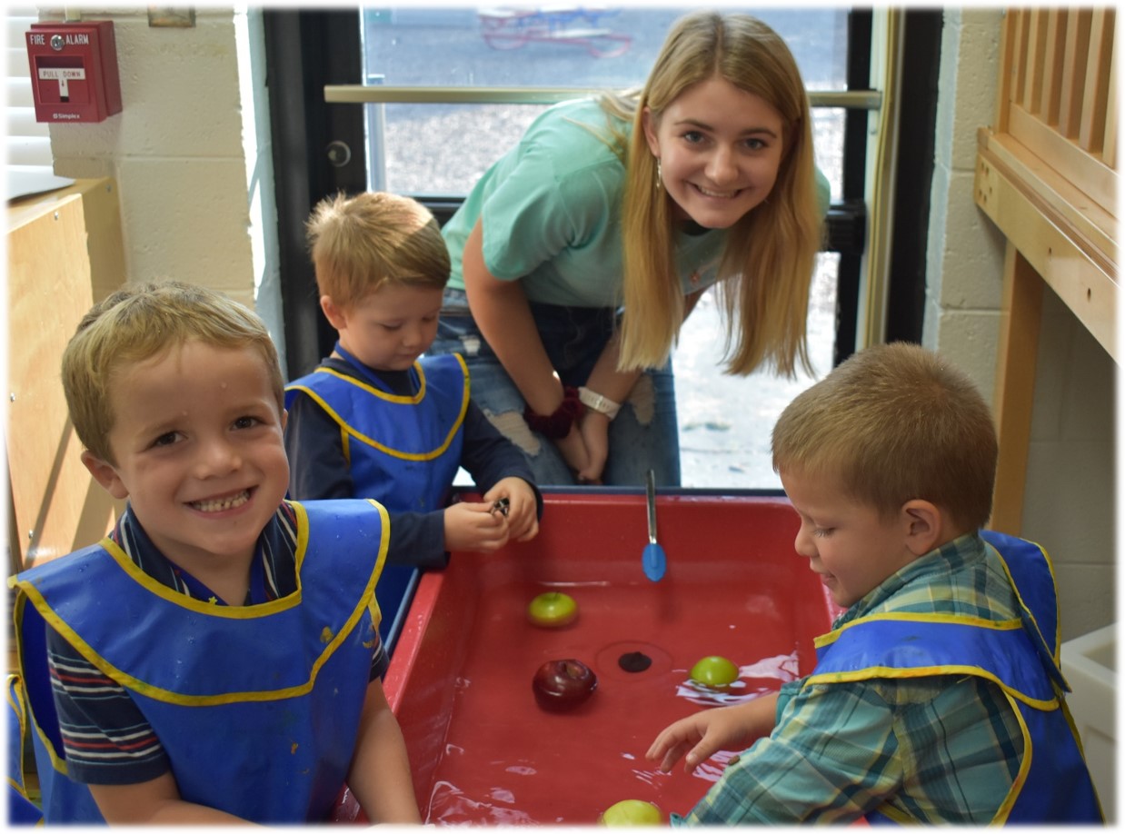 Students working with sensory play